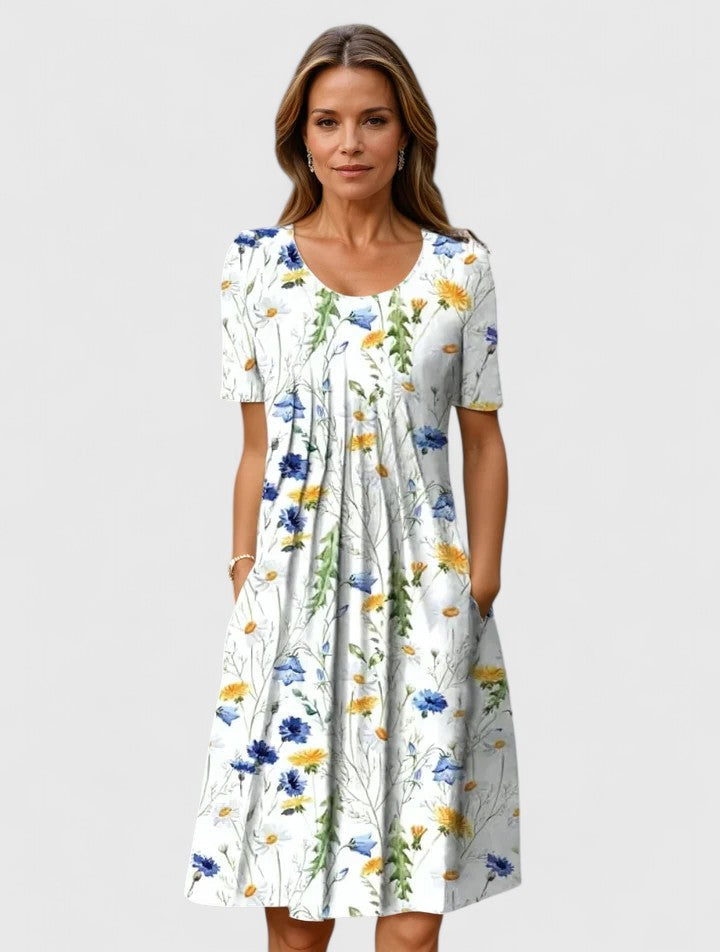 Elegant women's floral summer midi dress with short sleeves and practical pockets, perfect for casual or party wear.