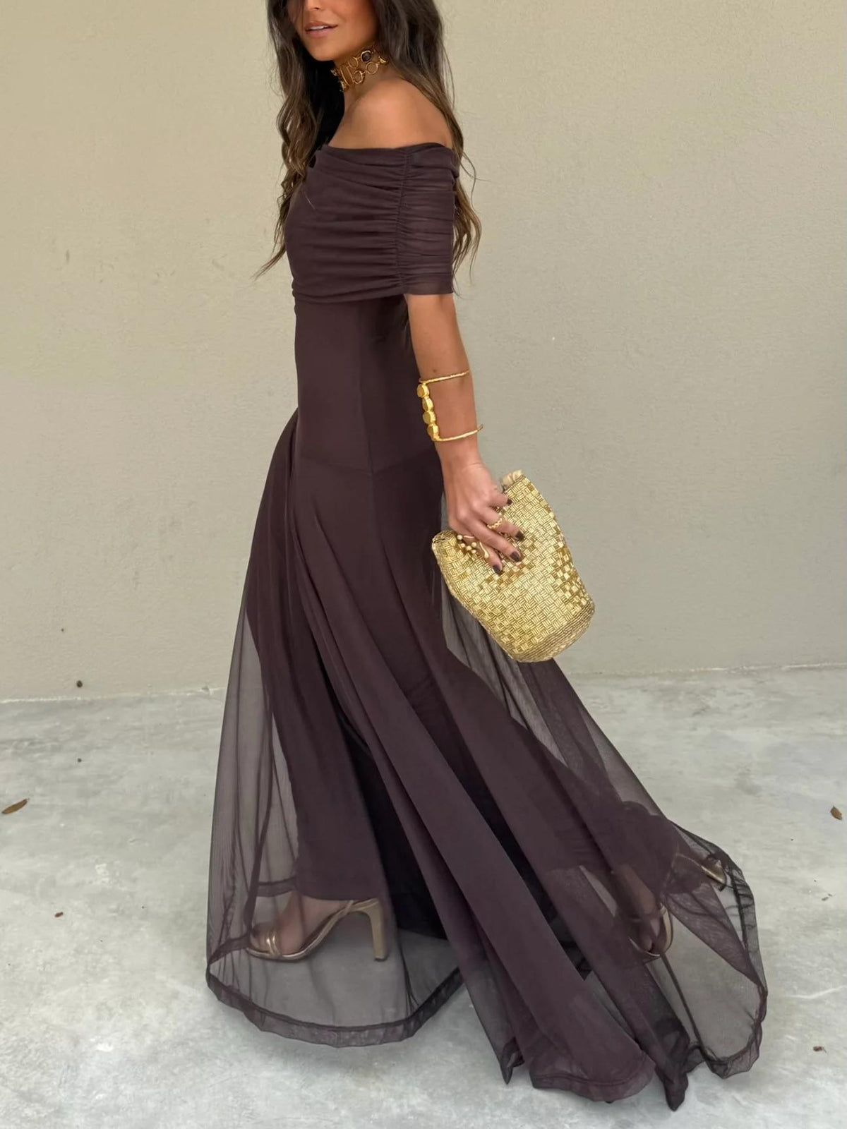 Flowy off-shoulder brown maxi dress for women, offering an elegant and romantic look for evening wear.